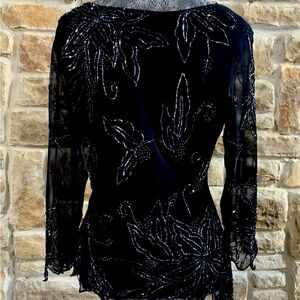 Vintage fit size medium to large. Hand beaded. See-through sleeves.  Beautiful.